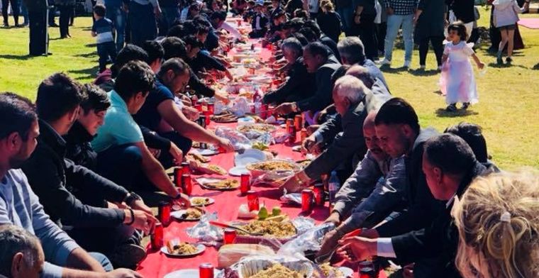 Refugees and Australians gather together at a You Belong Welcome Picnic.