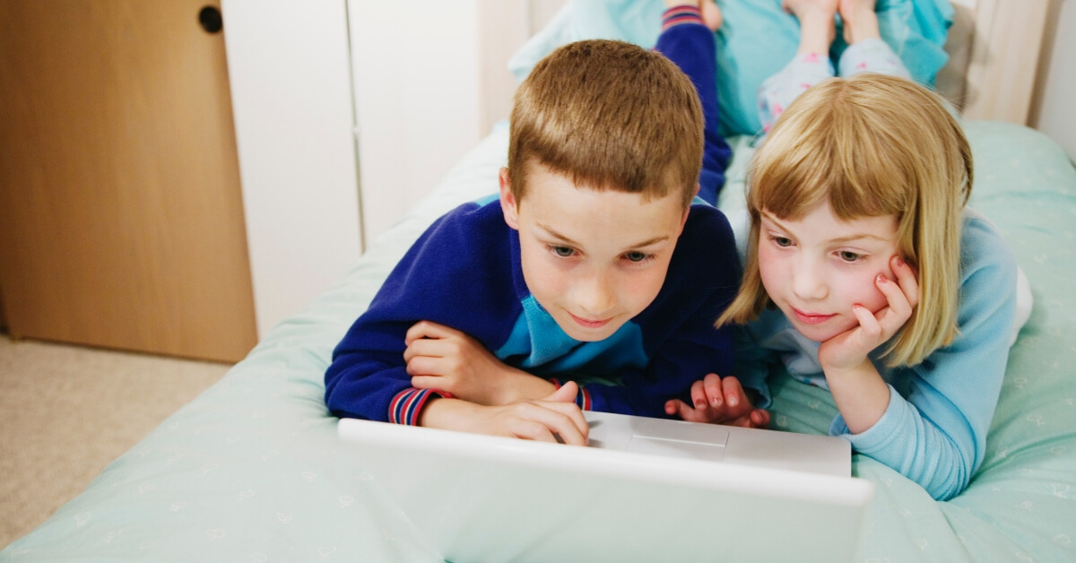 children looking at a laptop