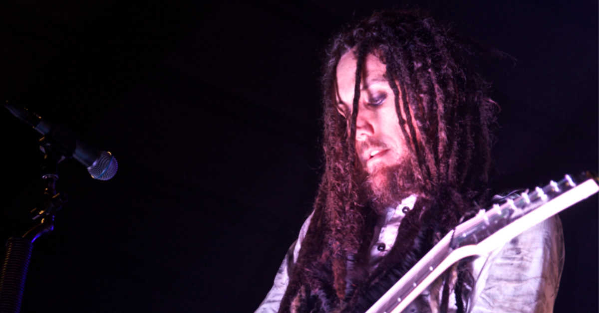 Brian Welch playing guitar on stage