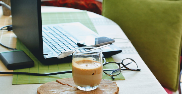 photo of a laptop and coffee on a desk