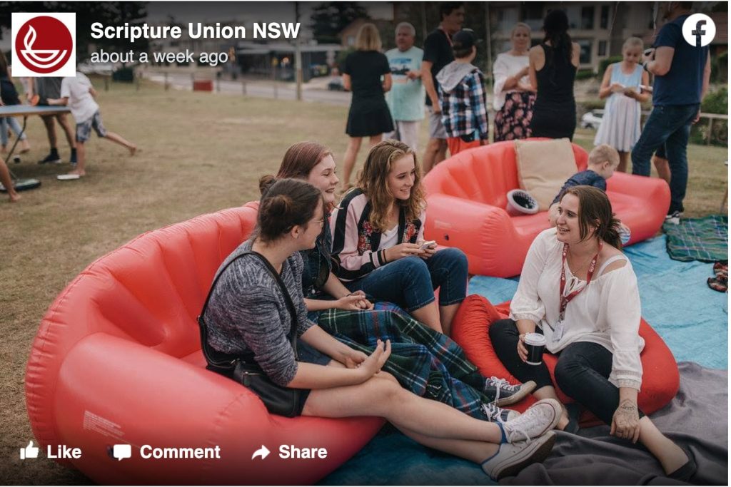 image of 4 young women sitting on an inflatable couch chatting with each other